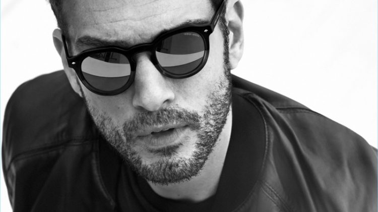 Sporting sunglasses, Tristan wears Giorgio Armani's AR 8093 style.