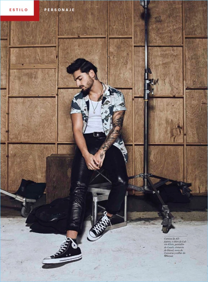 Gracing the pages of Esquire Latin America, Maluma wears an AllSaints shirt with a Calvin Klein t-shirt, Coach leather pants, and Converse sneakers.