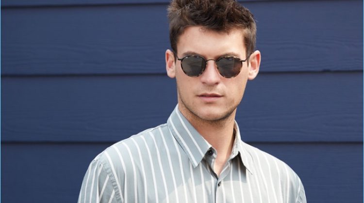 Front and center, Miles Garber wears a Vince striped shirt $225 with A.P.C. pants $275. Oliver Peoples sunglasses $455 and an Uri Minkoff leather pouch $175 complete the look.