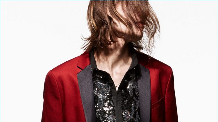 Marcel Castenmiller wears a red tuxedo jacket, embellished shirt, and skinny jeans by Zara Man.