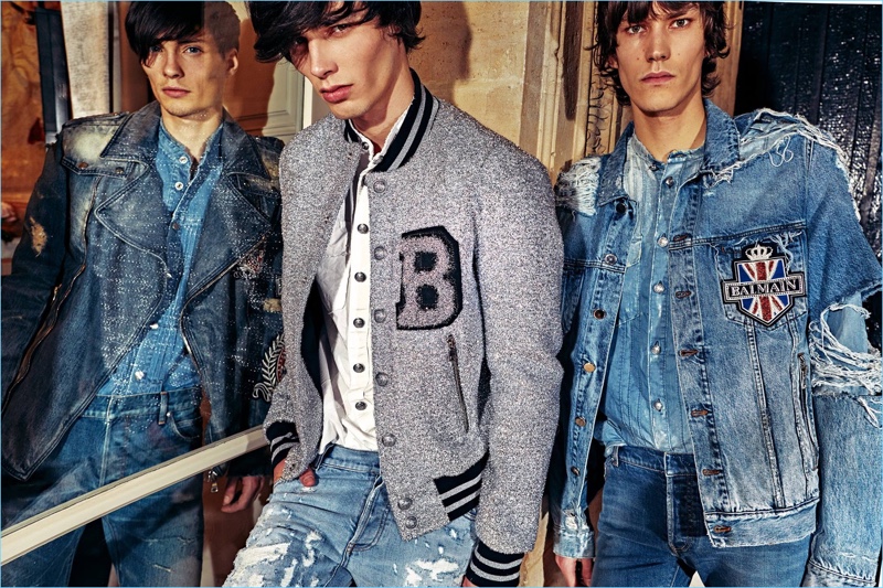 Clad in denim, models Victor Goujon, Oussama Guessoum, and Elias de Poot model looks from Balmain.