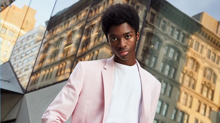 Model Alton Mason dons a pink suit from Express' latest lineup.