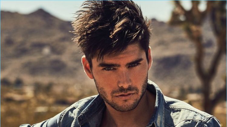 Donning a denim shirt, Charlie Matthews stars in Guess' fall-winter 2018 campaign.