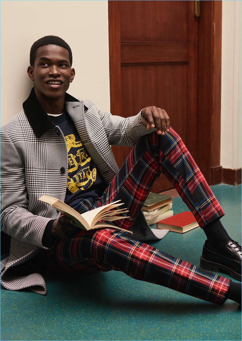 Embracing tartan, Salomon Diaz sports statement pants from H&M Studio's fall-winter 2018 men's collection.