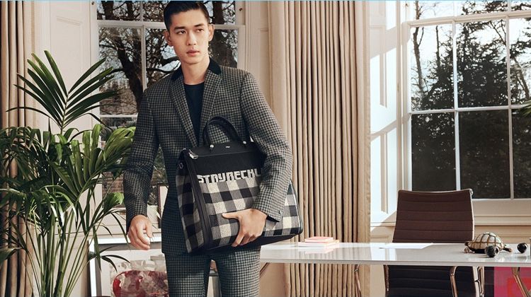 Keisuke Asano takes hold of Furla's Mercurio Tartan bag for its fall-winter 2018 campaign.