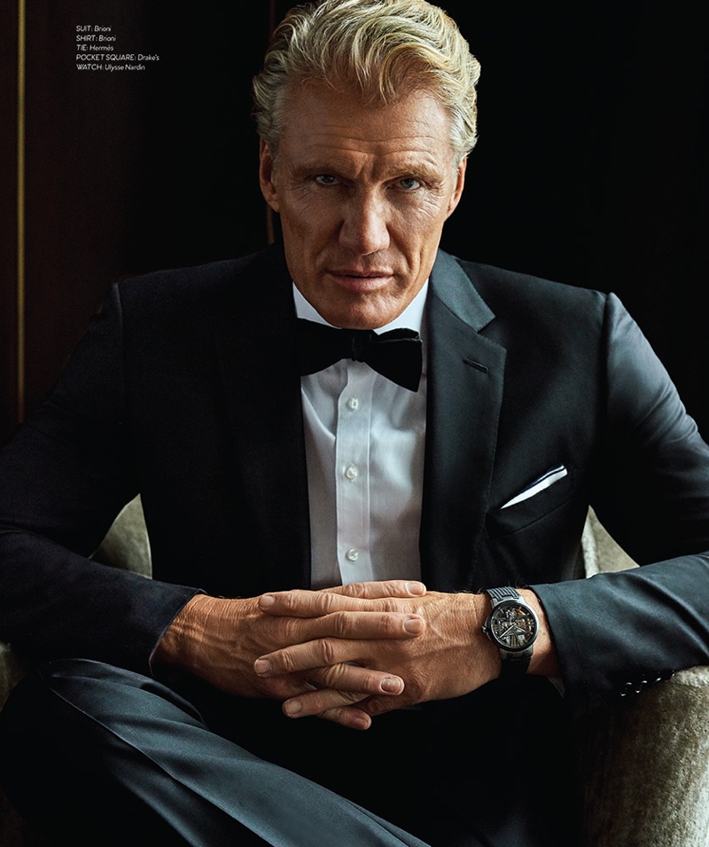 Donning a Brioni tuxedo and shirt, Dolph Lundgren also wears a Hermès bow-tie, Drake's pocket square, Bruno Magli boots, and an Ulysse Nardin watch.