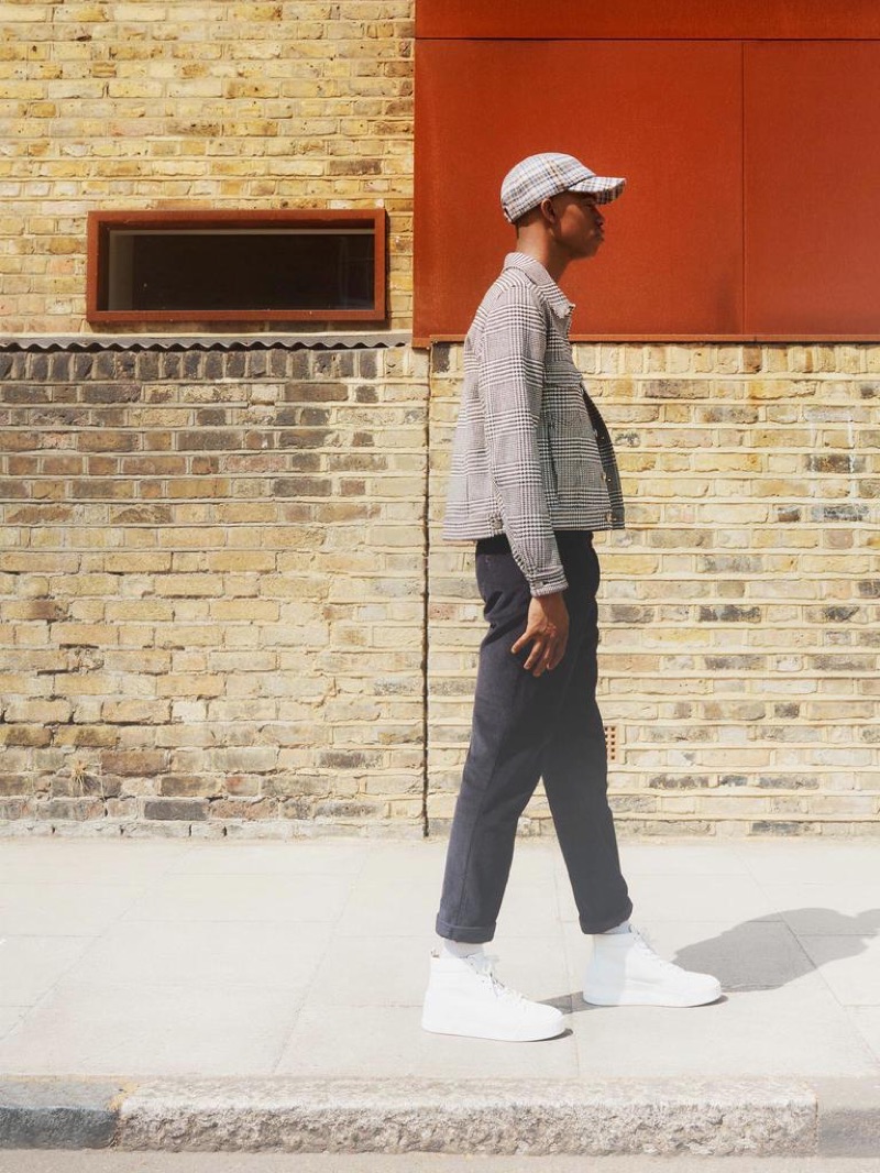 A KIND OF GUISE jacket £400 and trousers £185; A.P.C. T-shirt £74.95; STEPHAN SCHNEIDER cap £74.95; NIKE socks £12.95; CHRISTIAN LOUBOUTIN sneakers £785