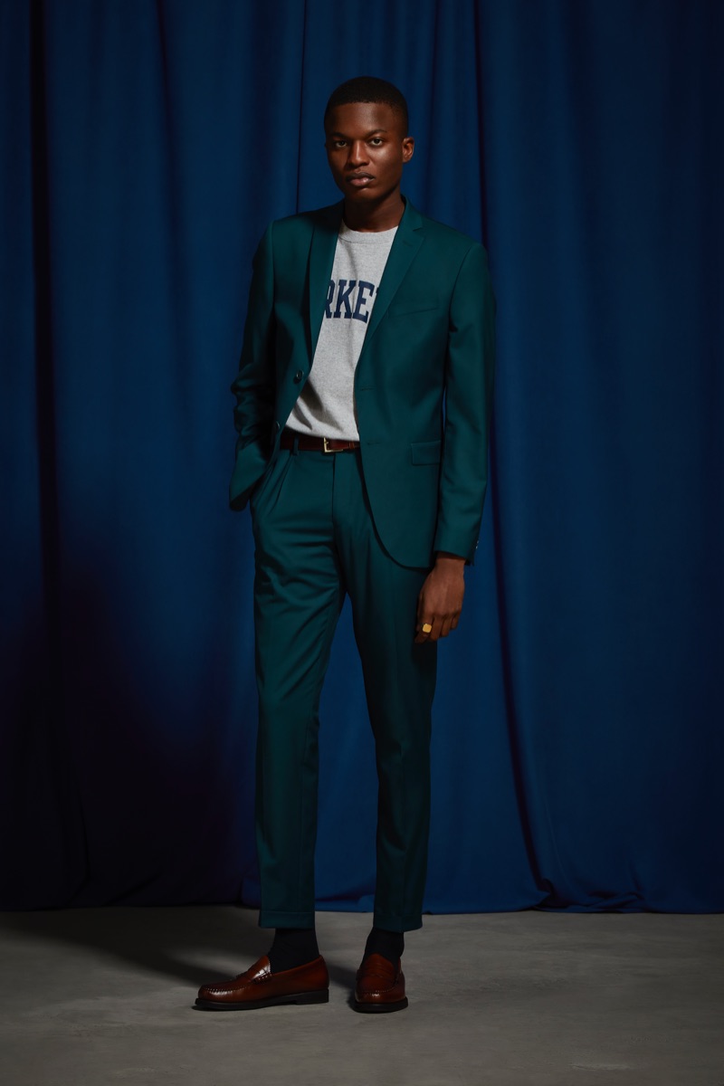 Christopher T. Smith sports an UO teal relaxed fit blazer and suit pants.