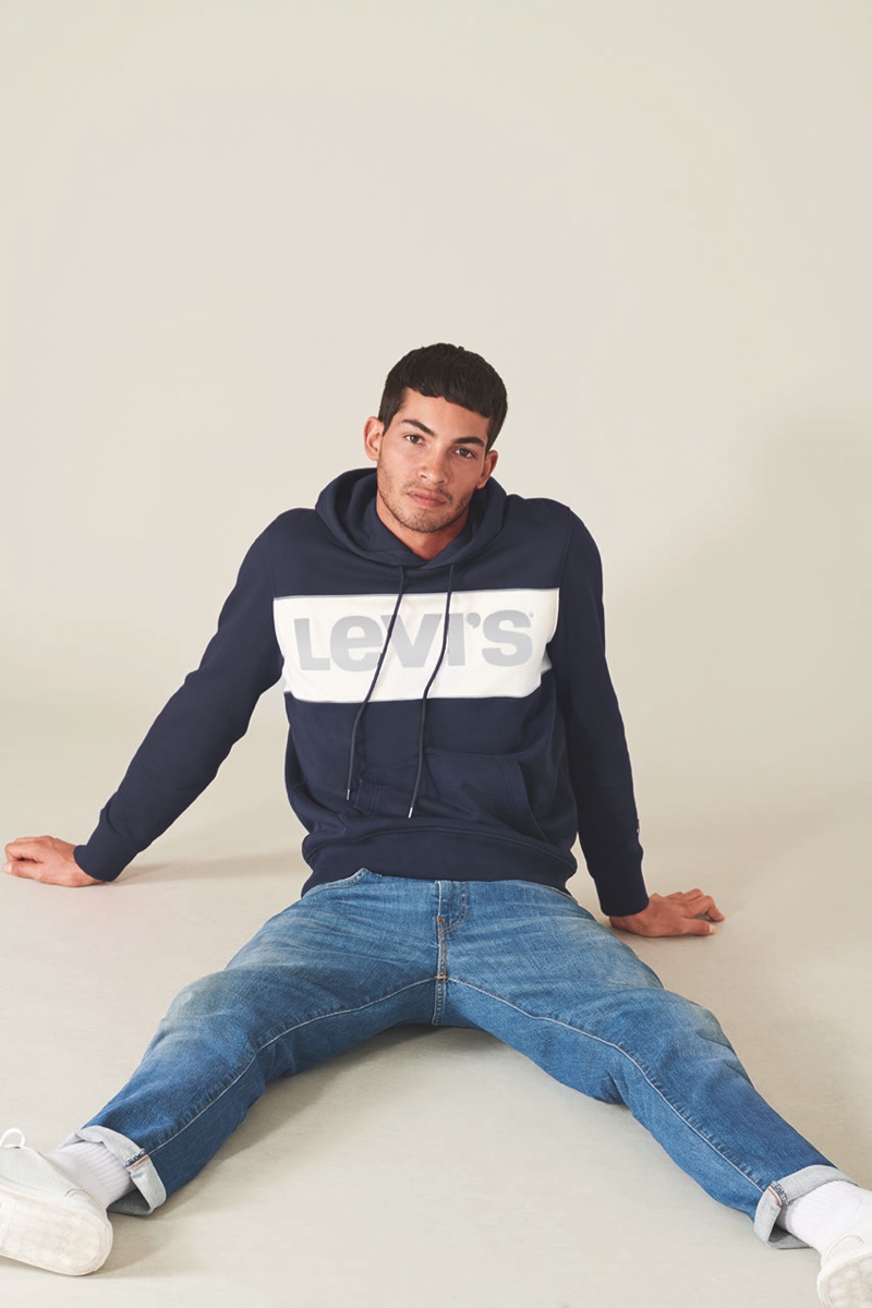 Antoine Lorvo sports a Levi's Red Tab hoodie in navy with jeans.