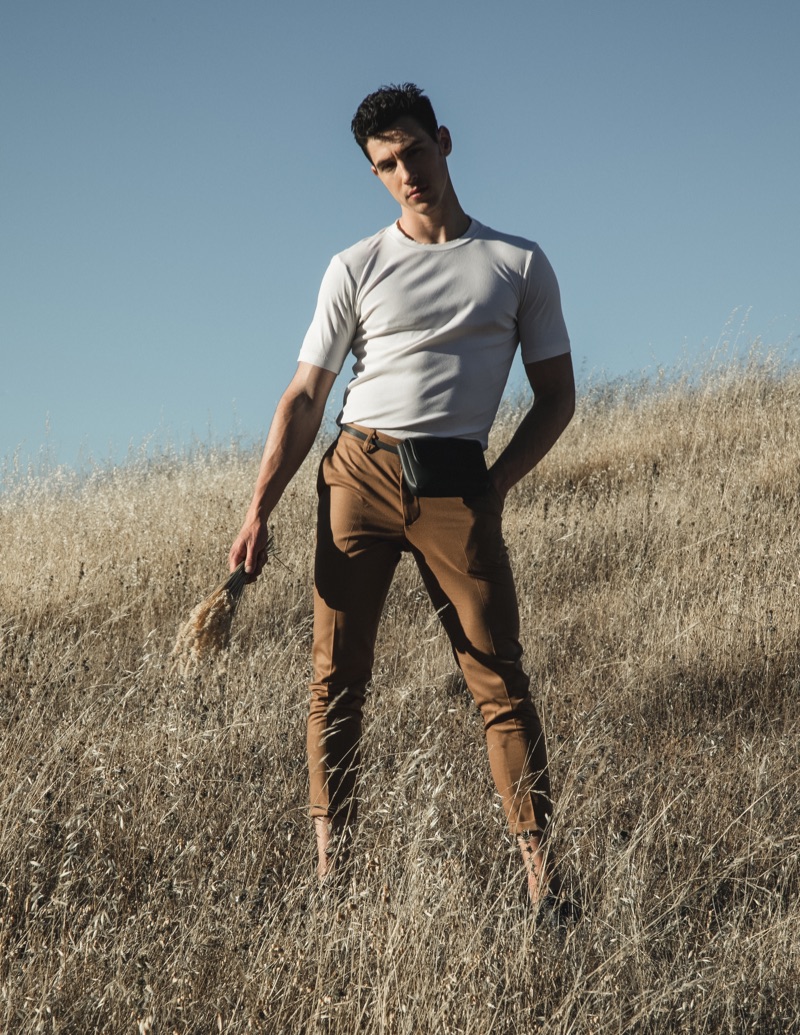 James wears shirt Calvin Klein, pants Gucci, and belt bag Oak & Fort.