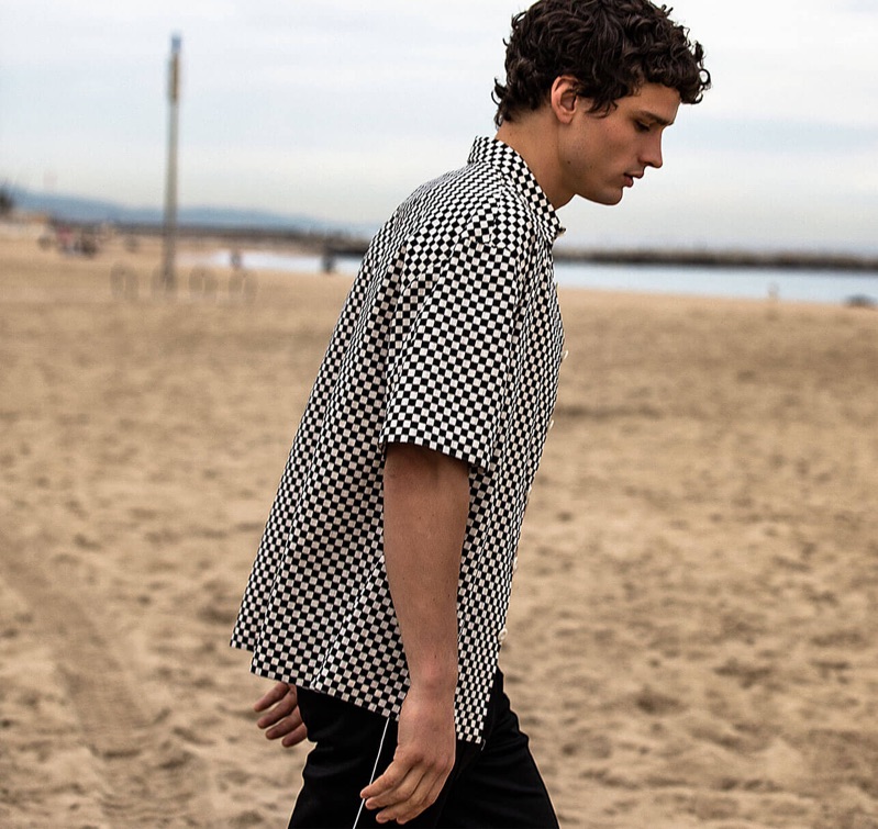 Taking to the beach, Simon Nessman fronts Sandro's spring-summer 2019 campaign.