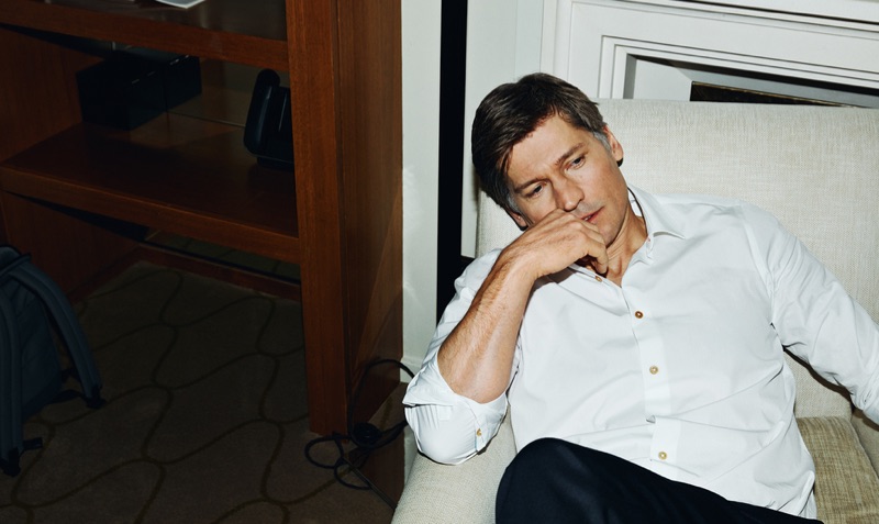 Starring in a new photo shoot, Nikolaj Coster-Waldau dons a Paul Smith shirt and BOSS pants.