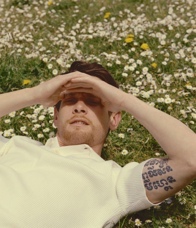 Jack O'Connell dons a textured Sandro polo shirt.