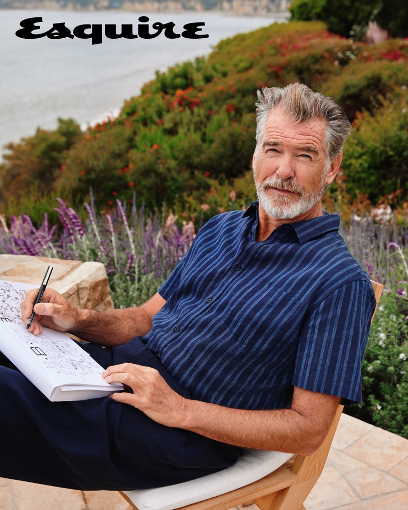 Pierce Brosnan dons a Vince striped shirt with Giorgio Armani trousers.