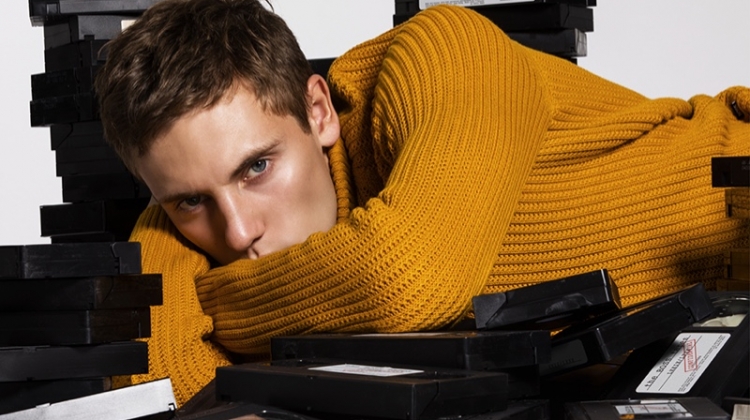 Embracing a pop of color, Anton wears a ribbed sweater from BOSS.