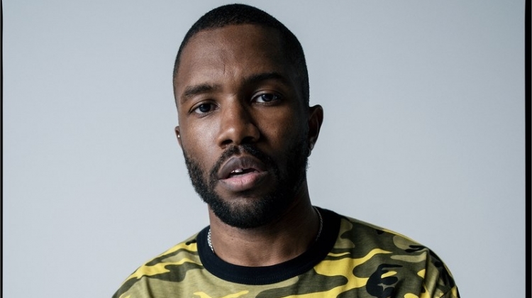 Front and center, Frank Ocean wears his own camouflage print t-shirt with a Louis Vuitton shorts skirt and vintage belt.