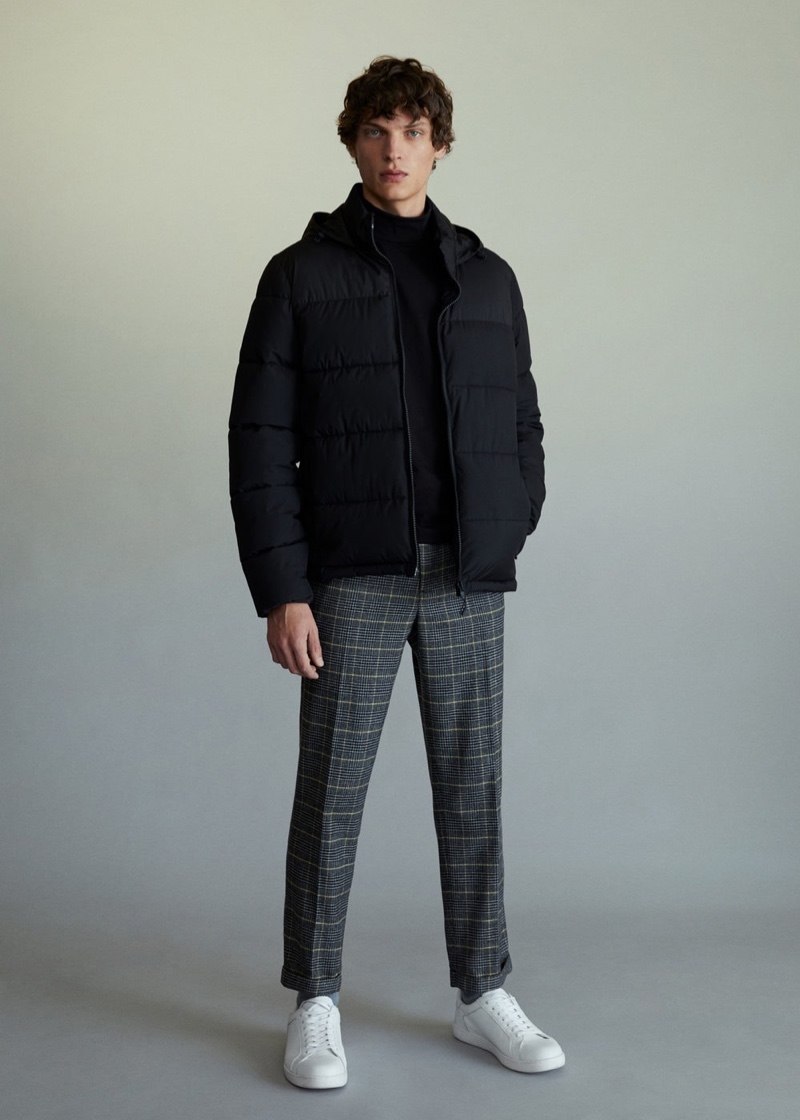 Taking to the studio, Valentin Caron models a look from Mango's latest arrivals.