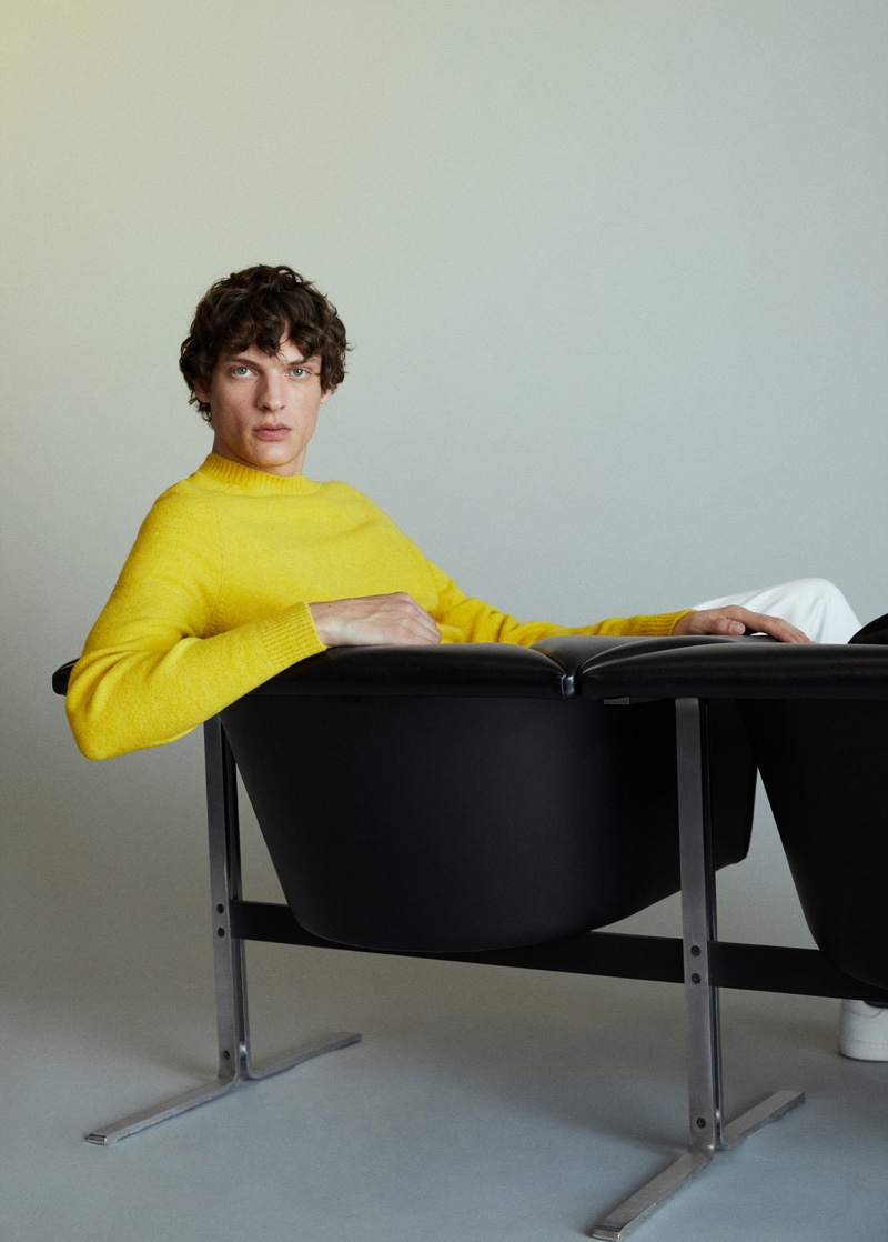 Making a splash in yellow, Valentin Caron wears a Mango sweater.