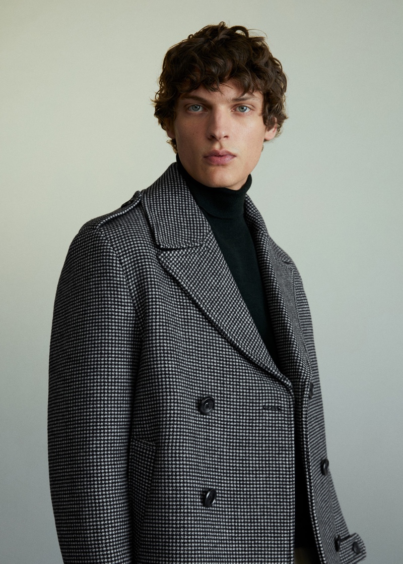 An elegant vision, Valentin Caron dons a double-breasted coat from Mango.