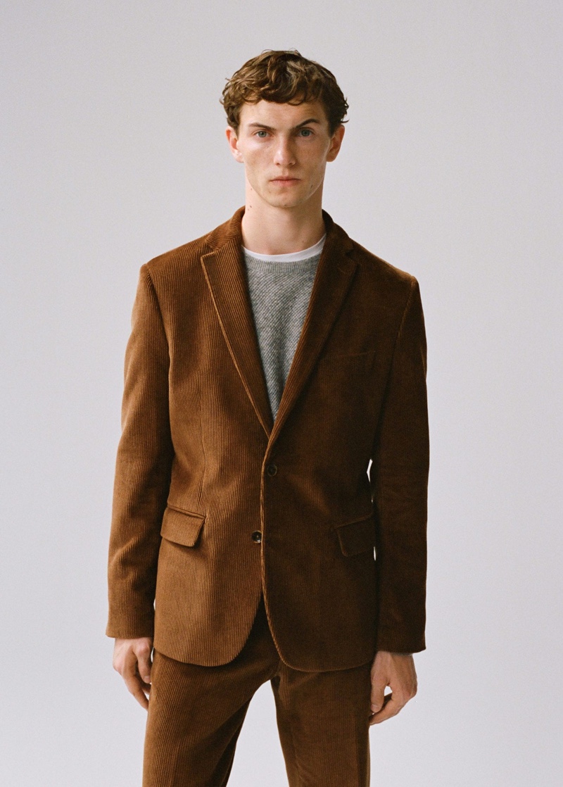 Luc Defont-Saviard dons a brown corduroy suit from Mango.