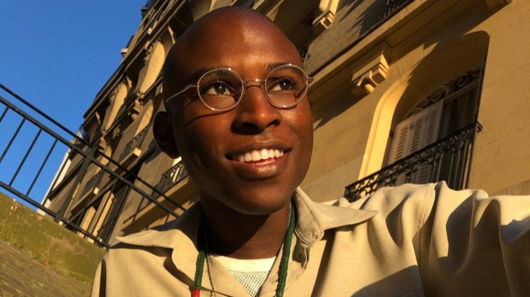 All smiles, Jibril Durimel wears Warby Parker's Simon glasses in brushed ink.