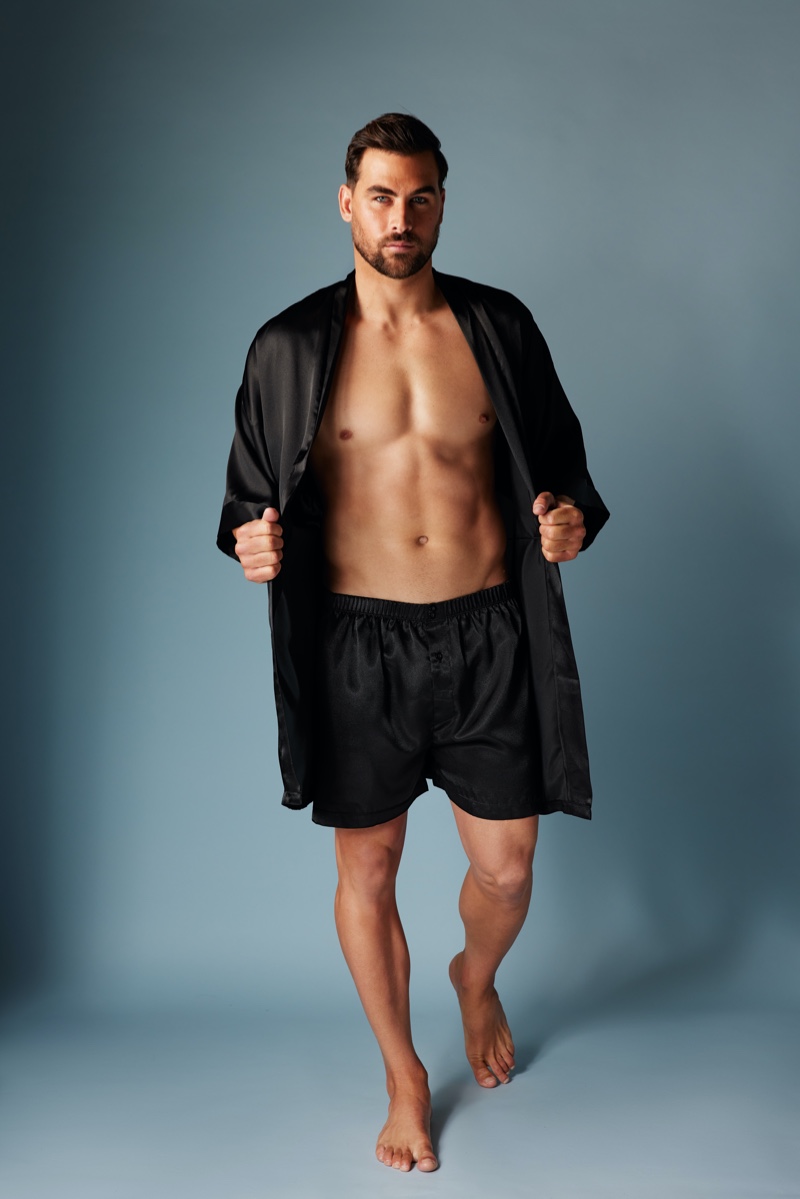 Front and center, Marc Jacobs sports a matching satin robe and boxers in black from Frederick's of Hollywood.