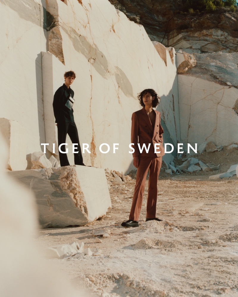 Models Serge Sergeev and Adam de la Tour appear in Tiger of Sweden's spring-summer 2021 men's campaign.