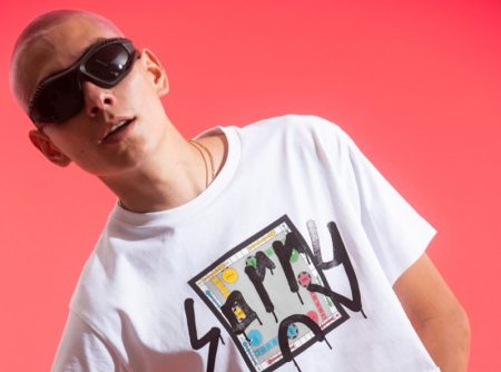 Evan Mock wears a cropped t-shirt from his Sorry in Advance x Giuseppe Zanotti collaboration.