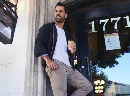 All smiles, Eric Decker wears New Balance 997H sneakers for DSW.