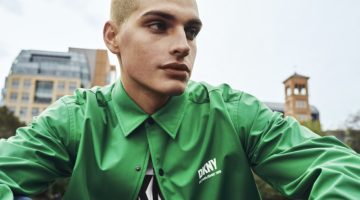 Cameron Porras sports a green coach jacket for DKNY's spring-summer 2023 campaign.