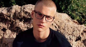 Wearing dark-framed glasses, Timo Pan fronts Tommy Hilfiger's spring-summer 2023 accessories campaign.