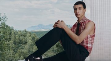 Anass Bouazzaoui sports a sleeveless shirt with trousers for Ferragamo's pre-fall 2023 campaign.