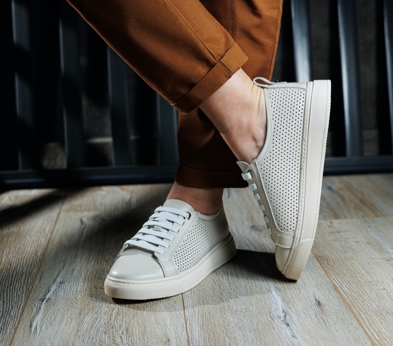 Sneakers bring a casual yet trendy twist to your resort wardrobe essentials. 