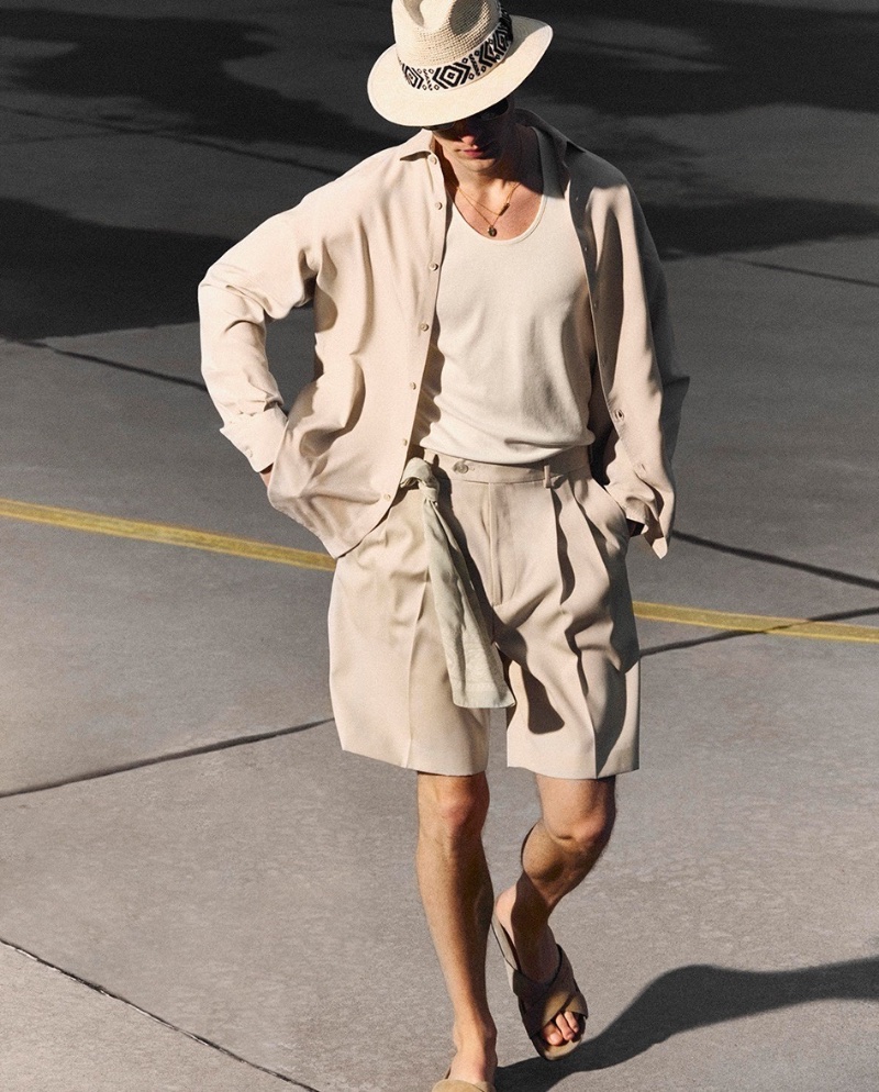 Ready for vacation, Roberto Sipos dons a Borsalino hat with a Zegna shirt, Auralee shorts, and Wales Bonner sandals.