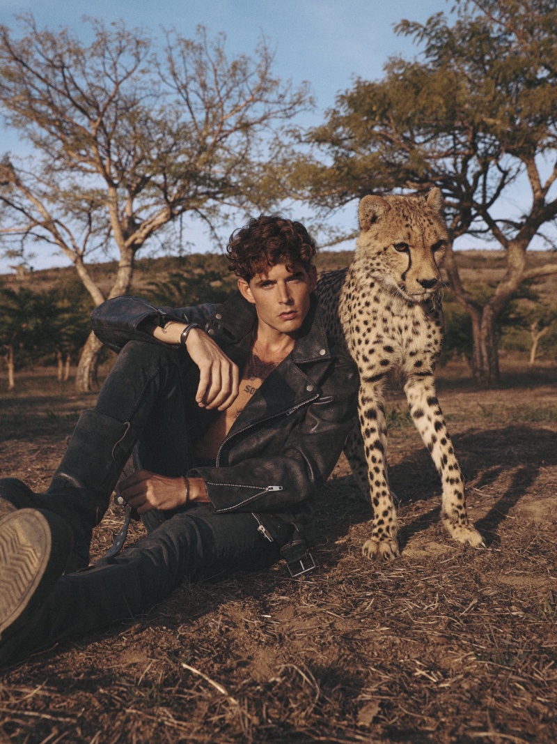 Stijn wears leather biker jacket Zara, jeans Mango, and vintage leather boots Dolce & Gabbana.