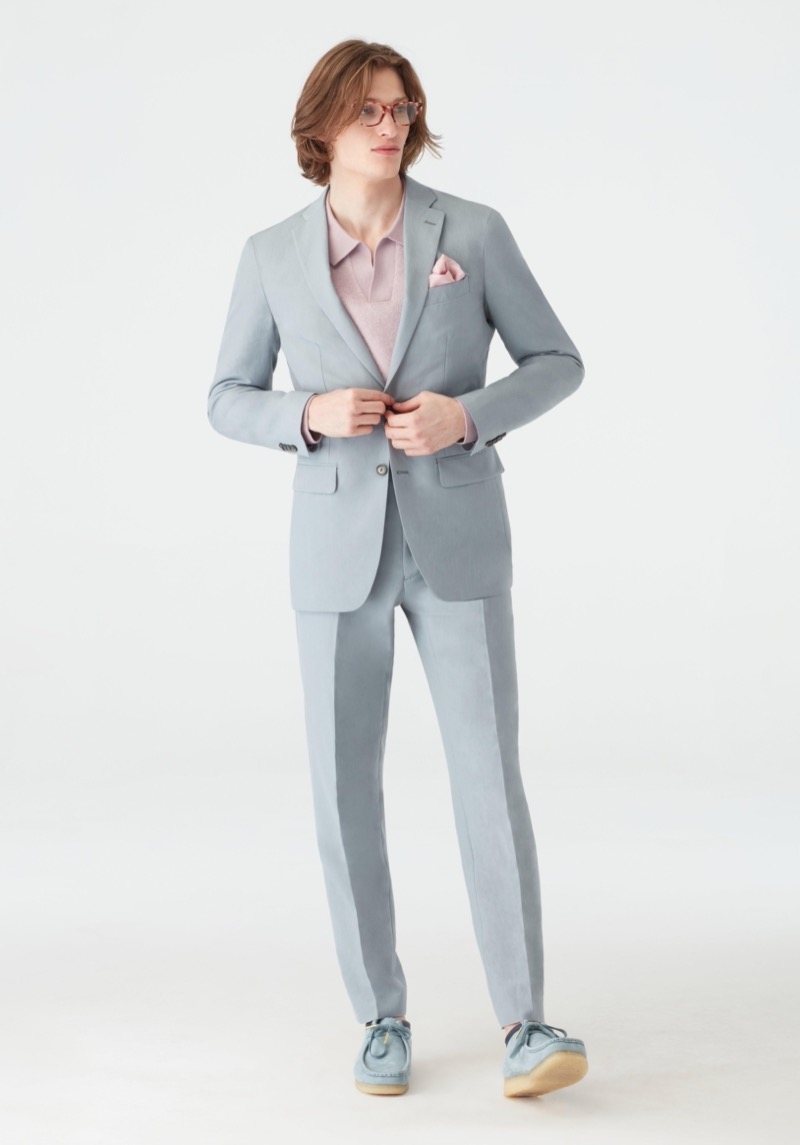 Perfect the balance between casual and formal with a grey suit and a fitted polo.