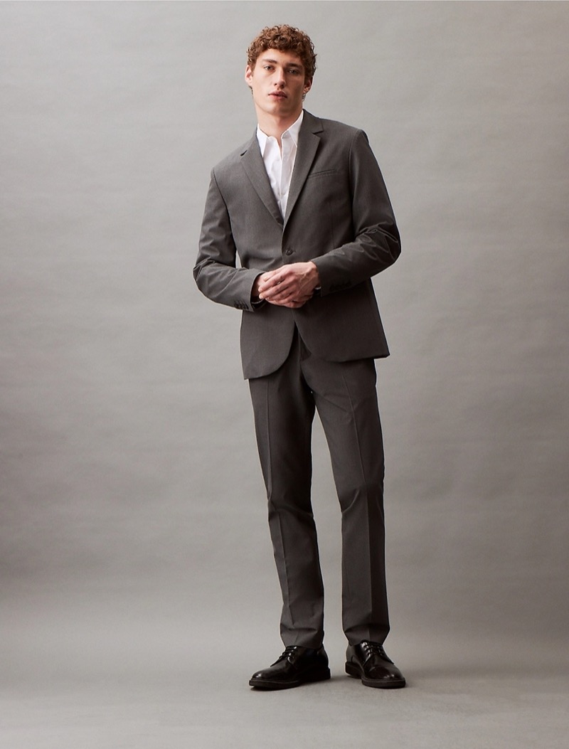 Always look sharp and professional in a grey suit paired with a white dress shirt.