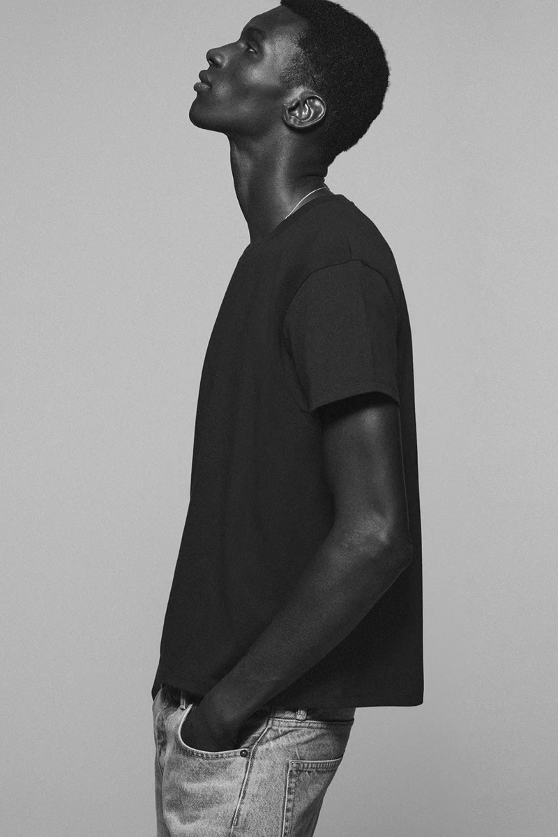 Momo Ndiaye showcases minimalist style in a T-shirt and jeans from the Zara “90s Archive” collection.