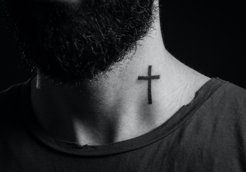 minimalist cross tattoo simplicity