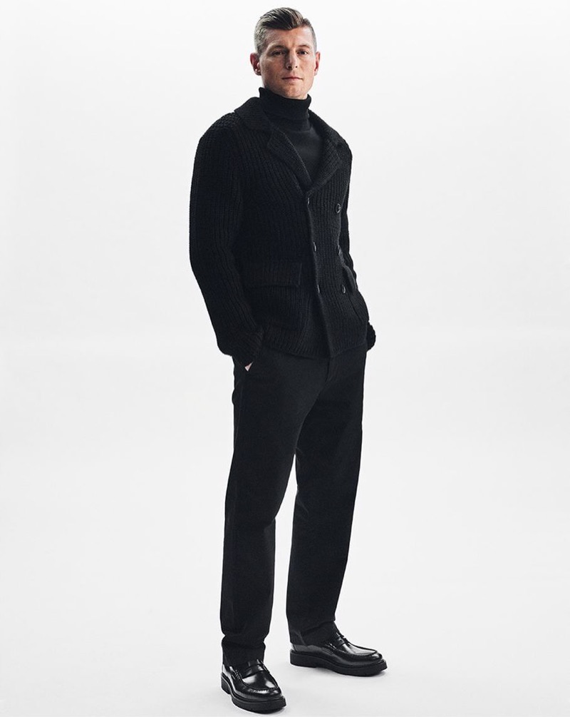 Wearing all black, Toni Kroos appears in Marc O’Polo’s fall-winter 2024 campaign.