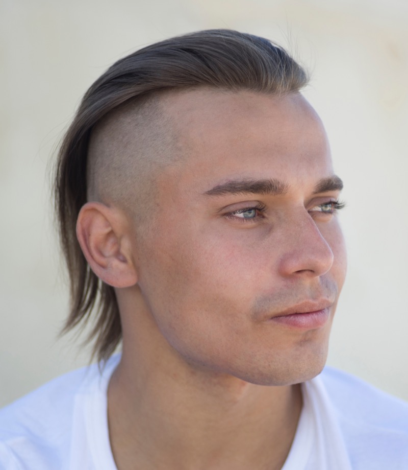 The undercut offers a bold, dramatic contrast that complements the smooth flow of straight hair.